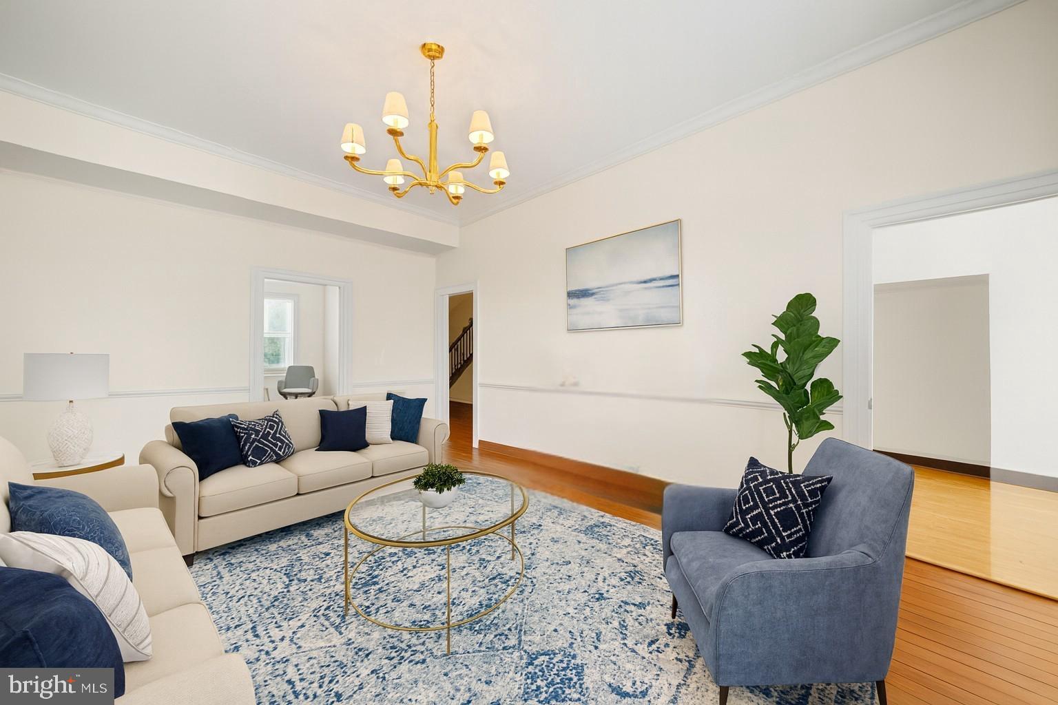 415 William Street, Unit A Fredericksburg, VA 22401 - Photo 4 of 17 a living room with furniture flowers and a chandelier