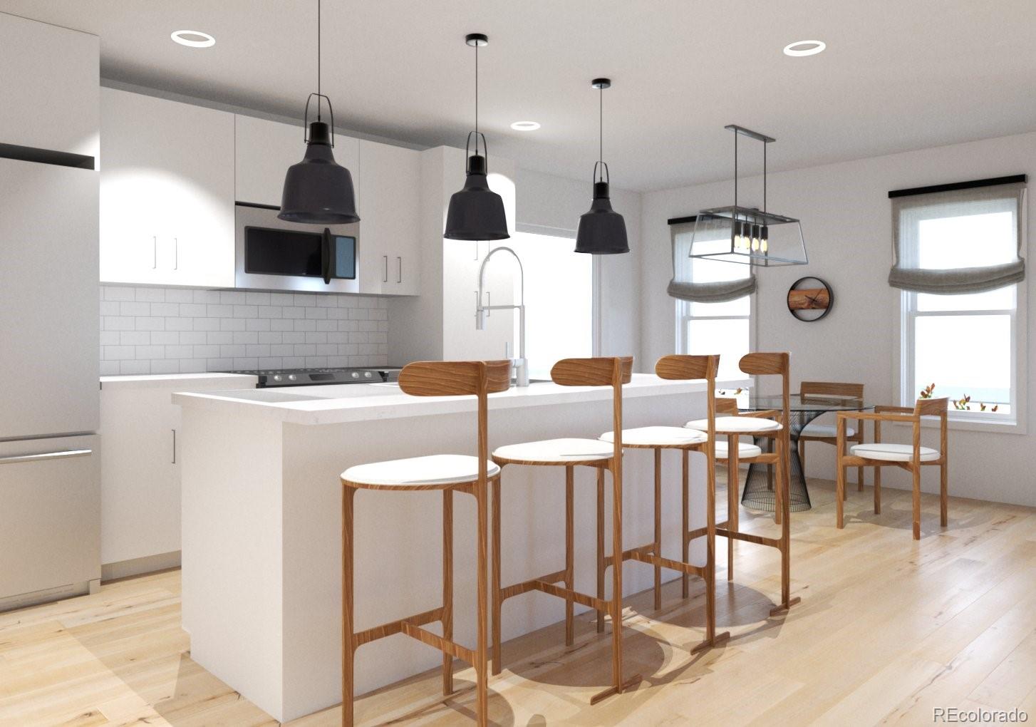 3790 Fenton Street Wheat Ridge, CO 80212 - Photo 3 of 8 a large kitchen with a table and chairs