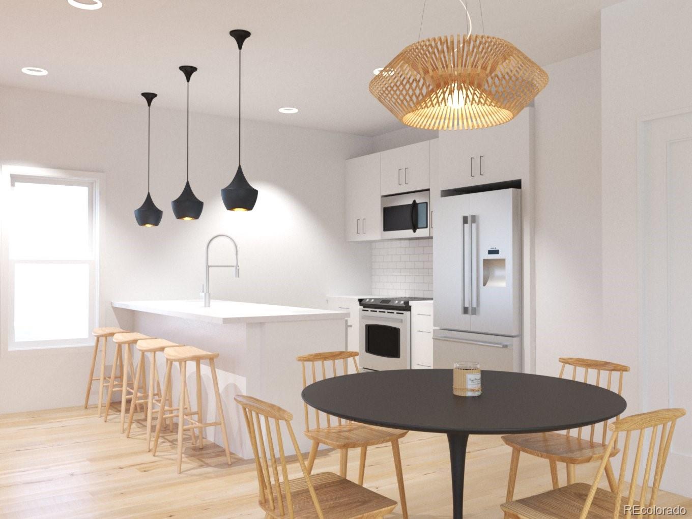 3790 Fenton Street Wheat Ridge, CO 80212 - Photo 4 of 8 a kitchen with stainless steel appliances granite countertop a dining table chairs and a refrigerator