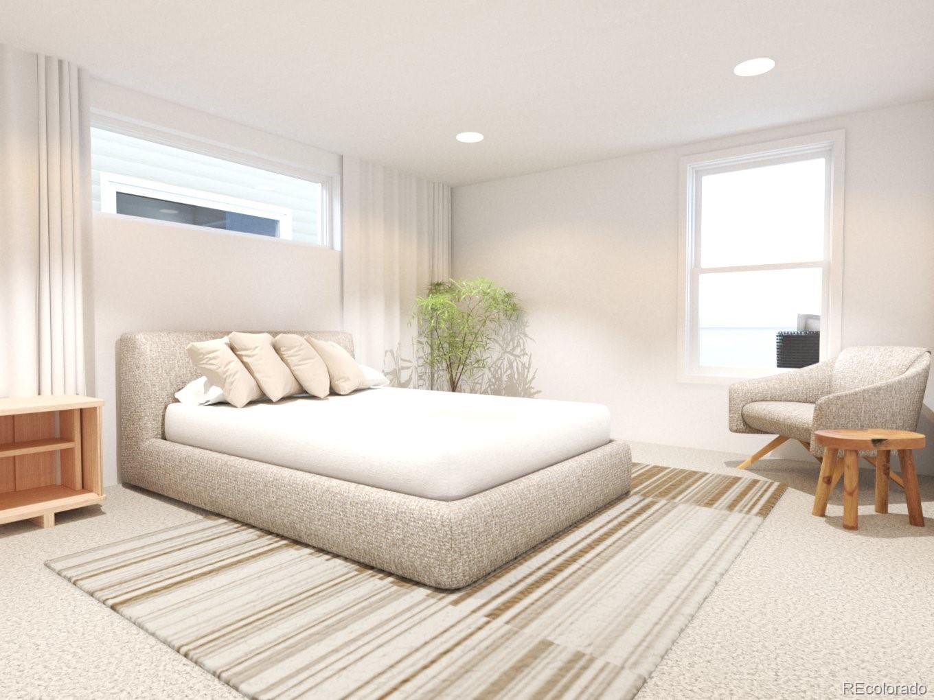 3790 Fenton Street Wheat Ridge, CO 80212 - Photo 6 of 8 a bedroom with a large bed and a couch