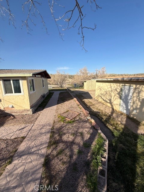 27697 Highway 58 Barstow, CA 92311 - Photo 10 of 45 Walkway between garage and house