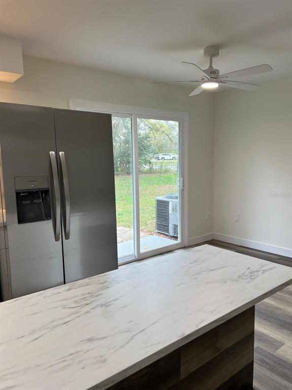 1812 Northeast 50th Street Ocala, FL 34479 - Photo 12 of 15 a kitchen with a refrigerator and a sink