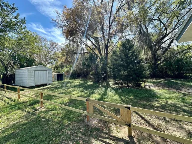 a backyard of a house with lots of green space