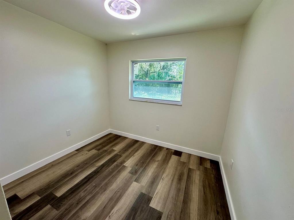 1812 Northeast 50th Street Ocala, FL 34479 - Photo 8 of 15 a view of a room with wooden floor