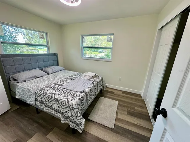 a bedroom with a bed and window