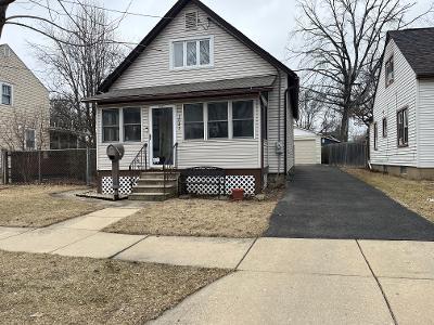 1021 Talma Street Aurora, IL 60505 - Photo 2 of 2 a front view of a house with a garage