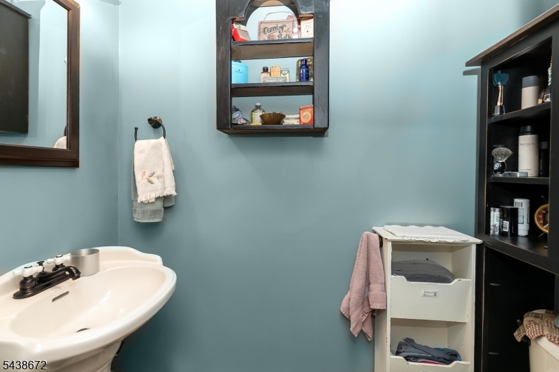 36 Main Street Flanders, NJ 07836 - Photo 14 of 31 a bathroom with a sink and a mirror
