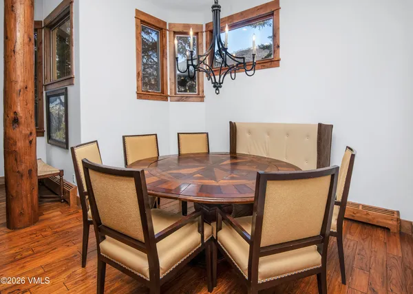 a view of a dining room with furniture and wooden floor