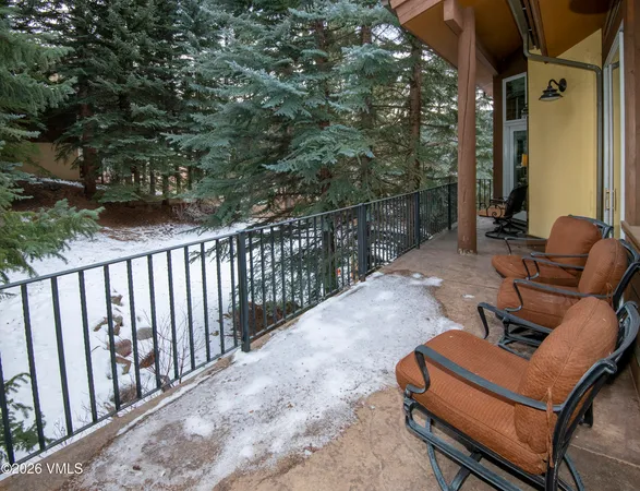 a view of backyard with outdoor seating