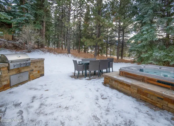 a view of a backyard with sitting area