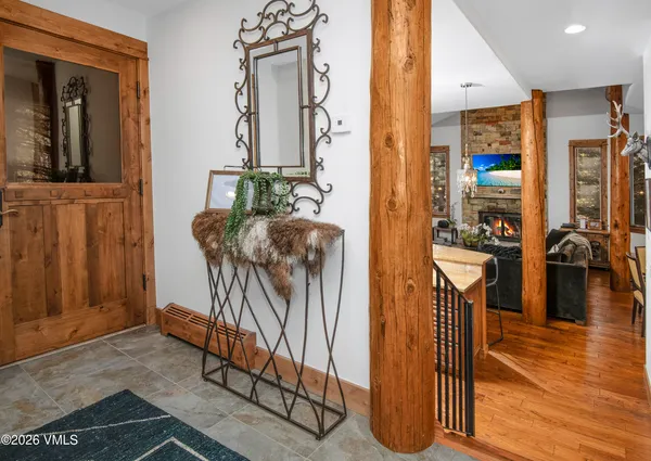 a view of living room filled with furniture and wooden floor