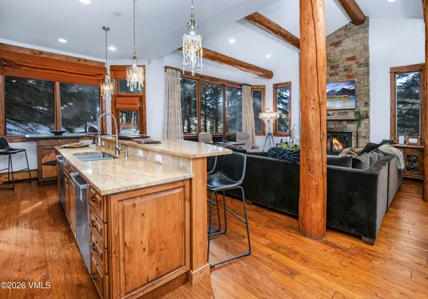a kitchen with stainless steel appliances granite countertop a stove and a refrigerator