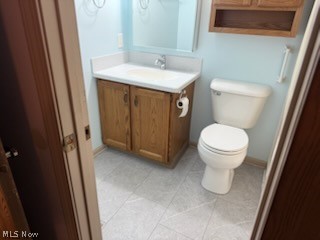97 Park Road Painesville, OH 44077 - Photo 14 of 18 Half bathroom with vanity and toilet