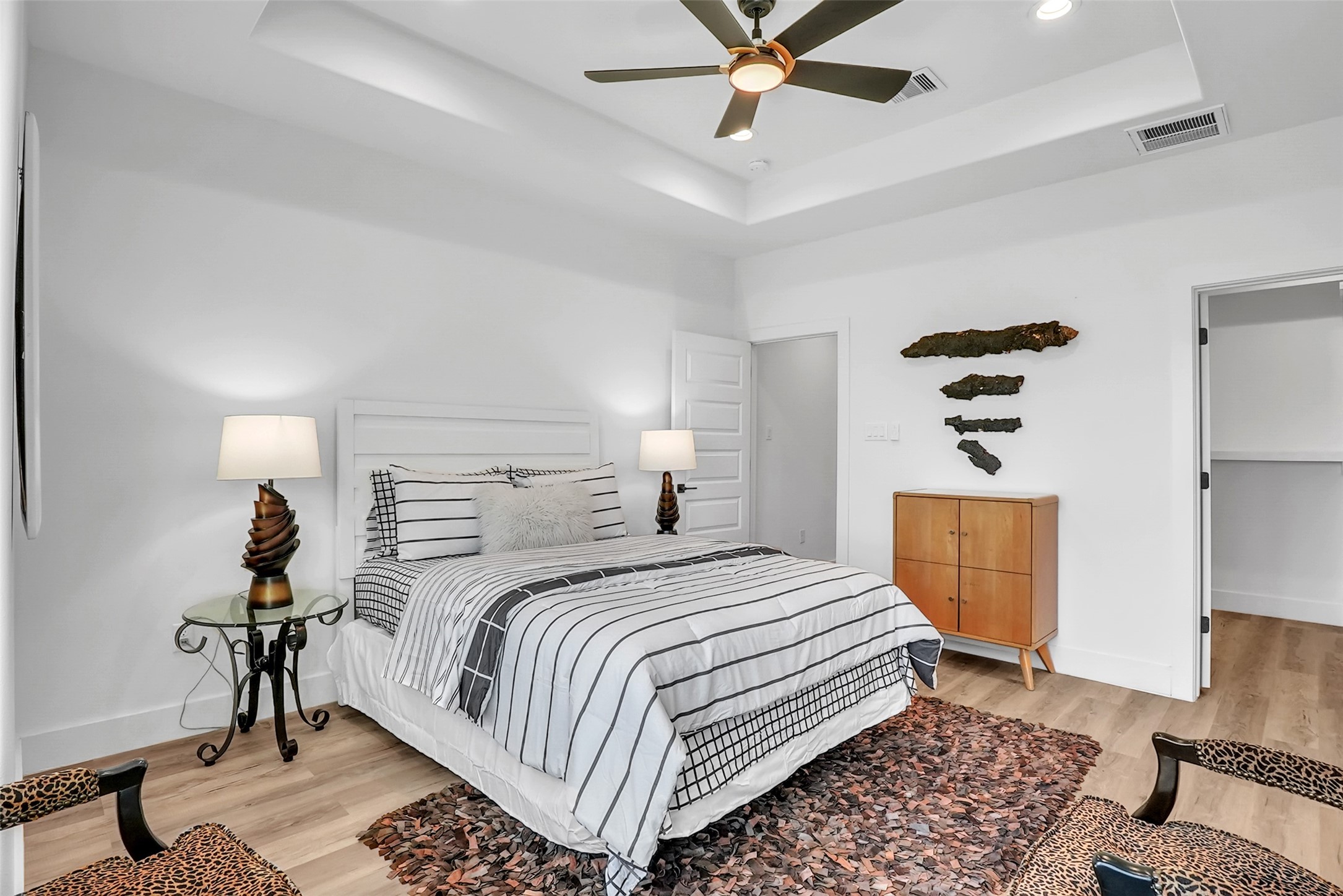 8012 Brandon Street Houston, TX 77051 - Photo 11 of 29 a bedroom with a bed and wooden floor
