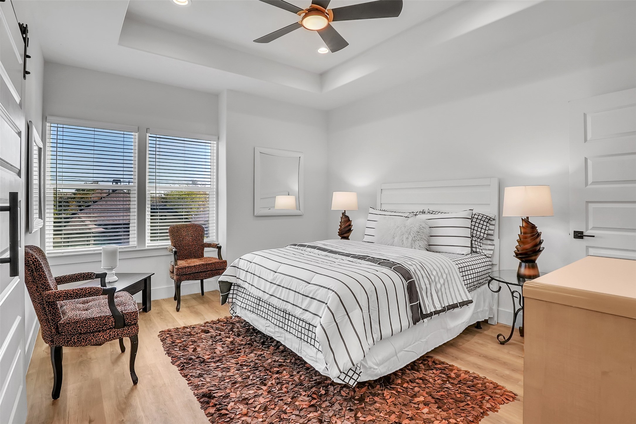8012 Brandon Street Houston, TX 77051 - Photo 18 of 29 a bedroom with a bed and a large window
