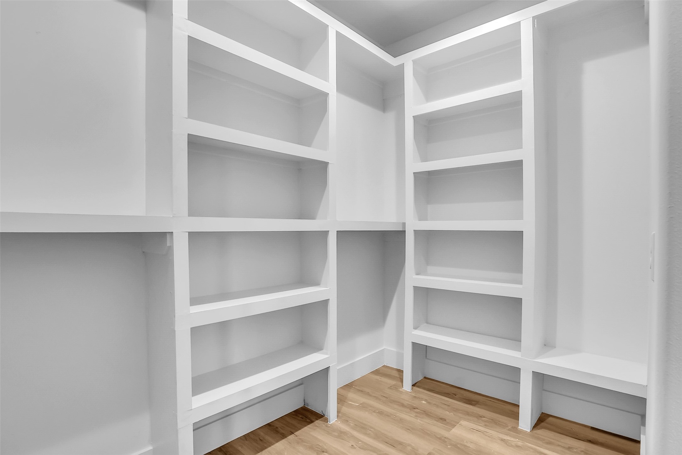 8012 Brandon Street Houston, TX 77051 - Photo 24 of 29 a view of walk in closet with empty racks