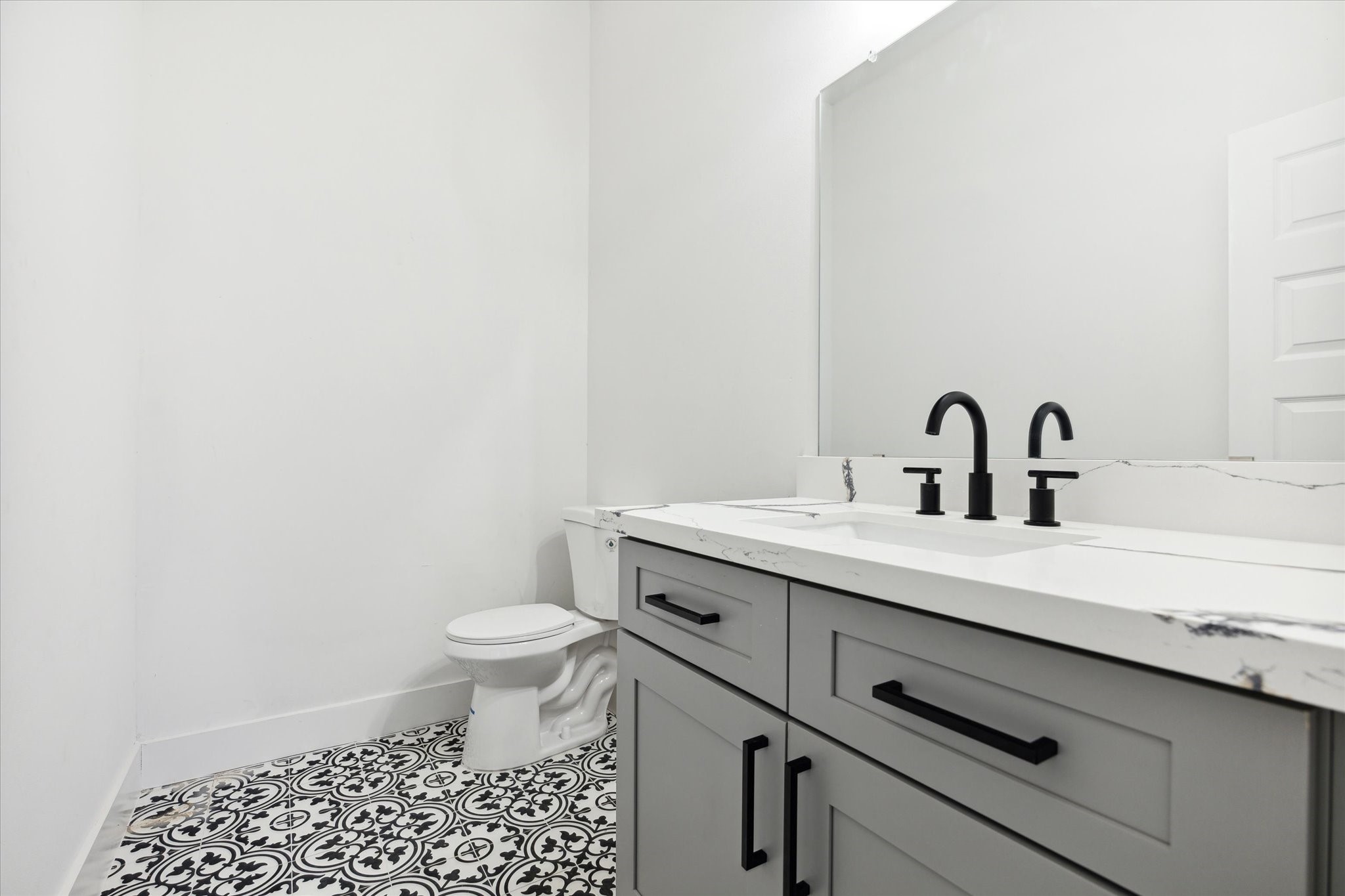 8012 Brandon Street Houston, TX 77051 - Photo 25 of 29 a bathroom with a sink a toilet and a mirror