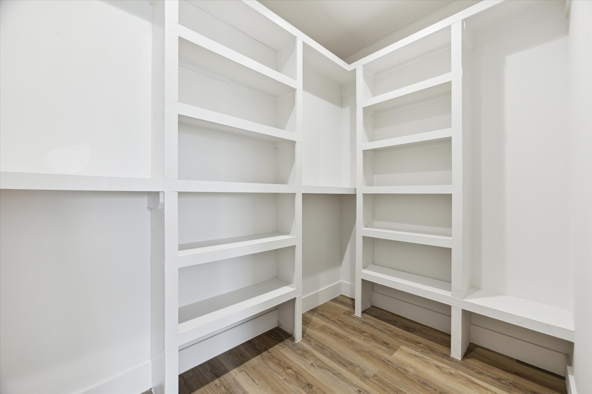 8012 Brandon Street Houston, TX 77051 - Photo 26 of 29 a view of walk in closet with empty racks
