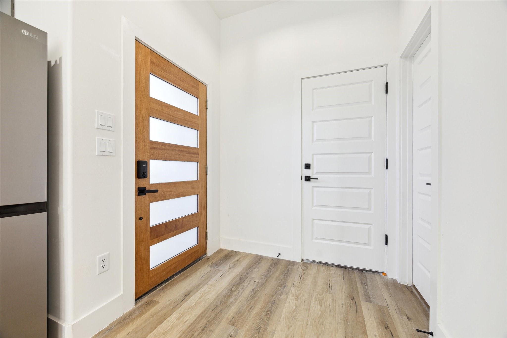 8012 Brandon Street Houston, TX 77051 - Photo 3 of 29 an empty room with wooden floor closet and windows