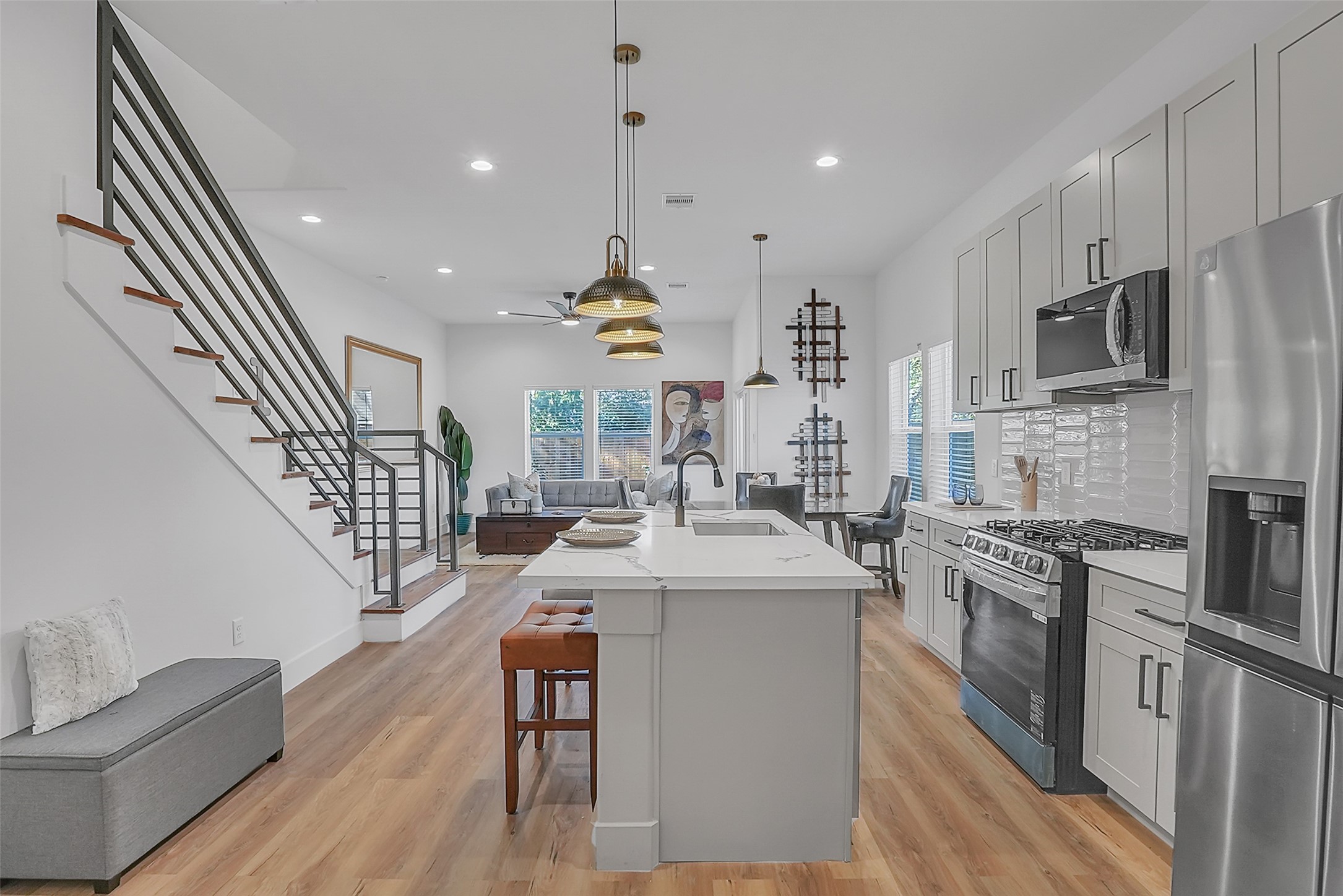 8012 Brandon Street Houston, TX 77051 - Photo 8 of 29 a kitchen with stainless steel appliances granite countertop a sink a stove a refrigerator cabinets and a dining table