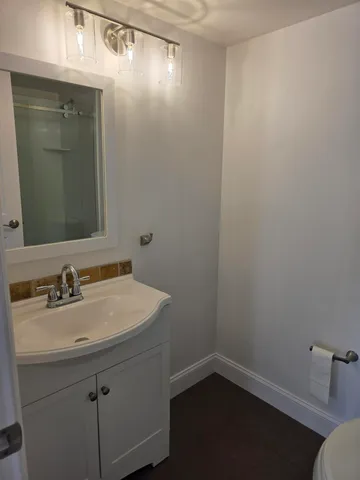 a bathroom with a sink and mirror