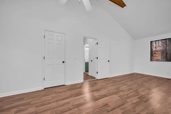 a view of room with wooden floor