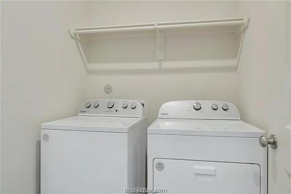a utility room with dryer and washer