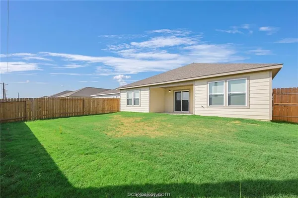 a view of a yard in front of a house