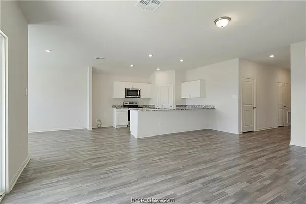 a view of kitchen with wooden floor