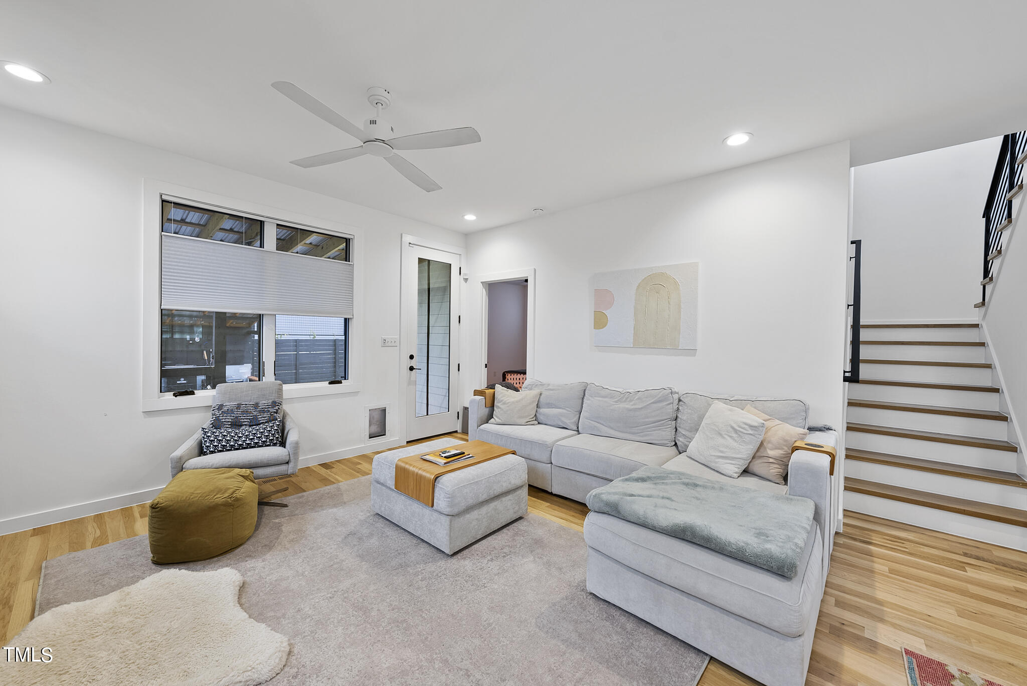 302 North State Street Raleigh, NC 27610 - Photo 11 of 33 a living room with furniture and a large window