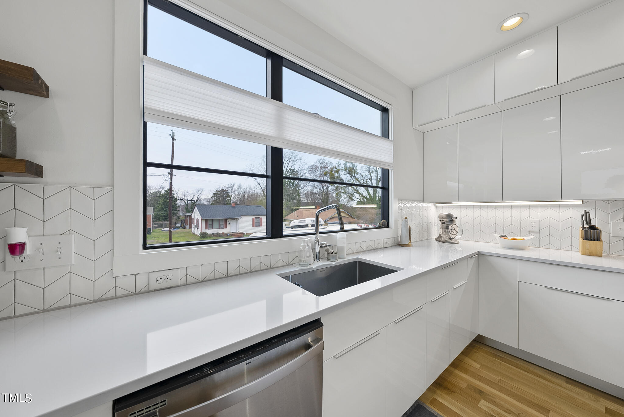 302 North State Street Raleigh, NC 27610 - Photo 4 of 33 a kitchen with a sink and large window
