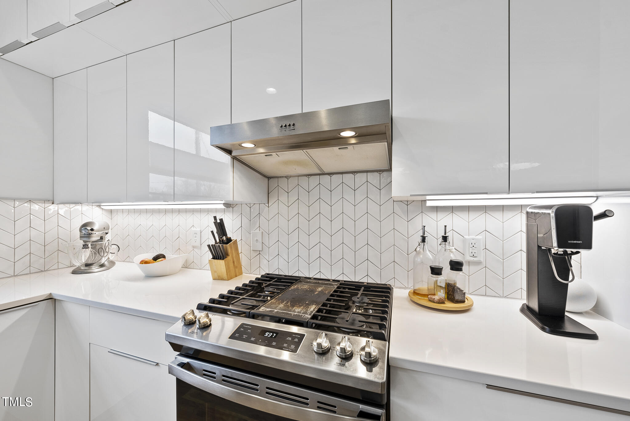 302 North State Street Raleigh, NC 27610 - Photo 6 of 33 a white stove top oven sitting inside of a kitchen