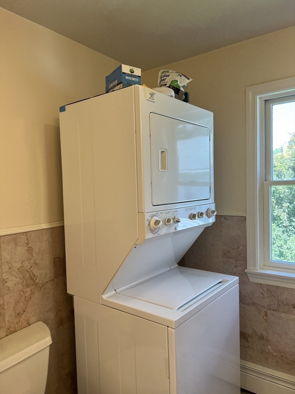 11 Garrison Road, Unit 1 Arlington, MA 02474 - Photo 35 of 42 a utility room with dryer and washer