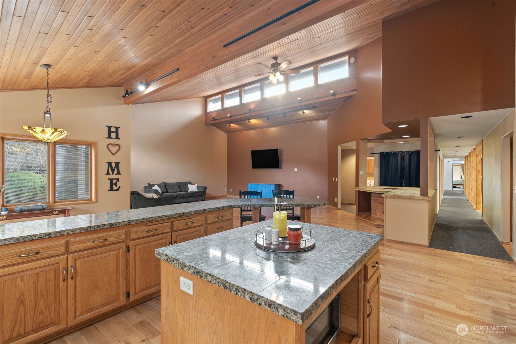 4209 South Eastern Road Spokane, WA 99223 - Photo 17 of 40 a kitchen with a sink a counter space and stainless steel appliances
