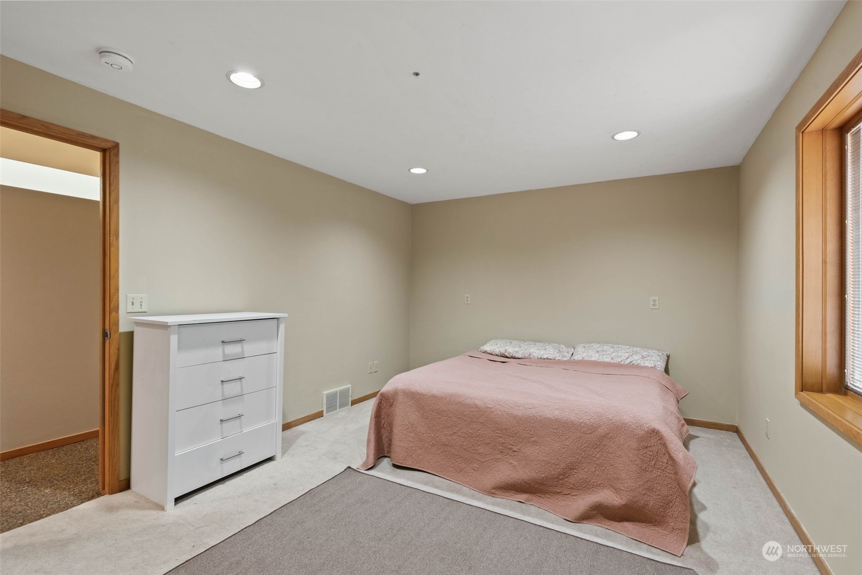 4209 South Eastern Road Spokane, WA 99223 - Photo 28 of 40 a bedroom with a bed and a window