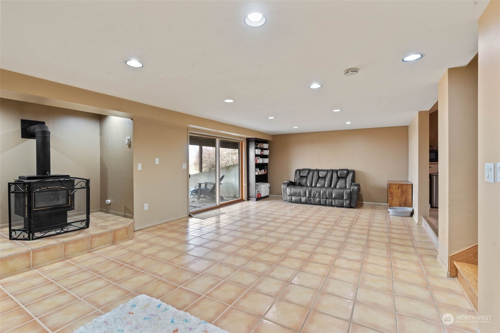 4209 South Eastern Road Spokane, WA 99223 - Photo 29 of 40 a large room with a large window and furniture