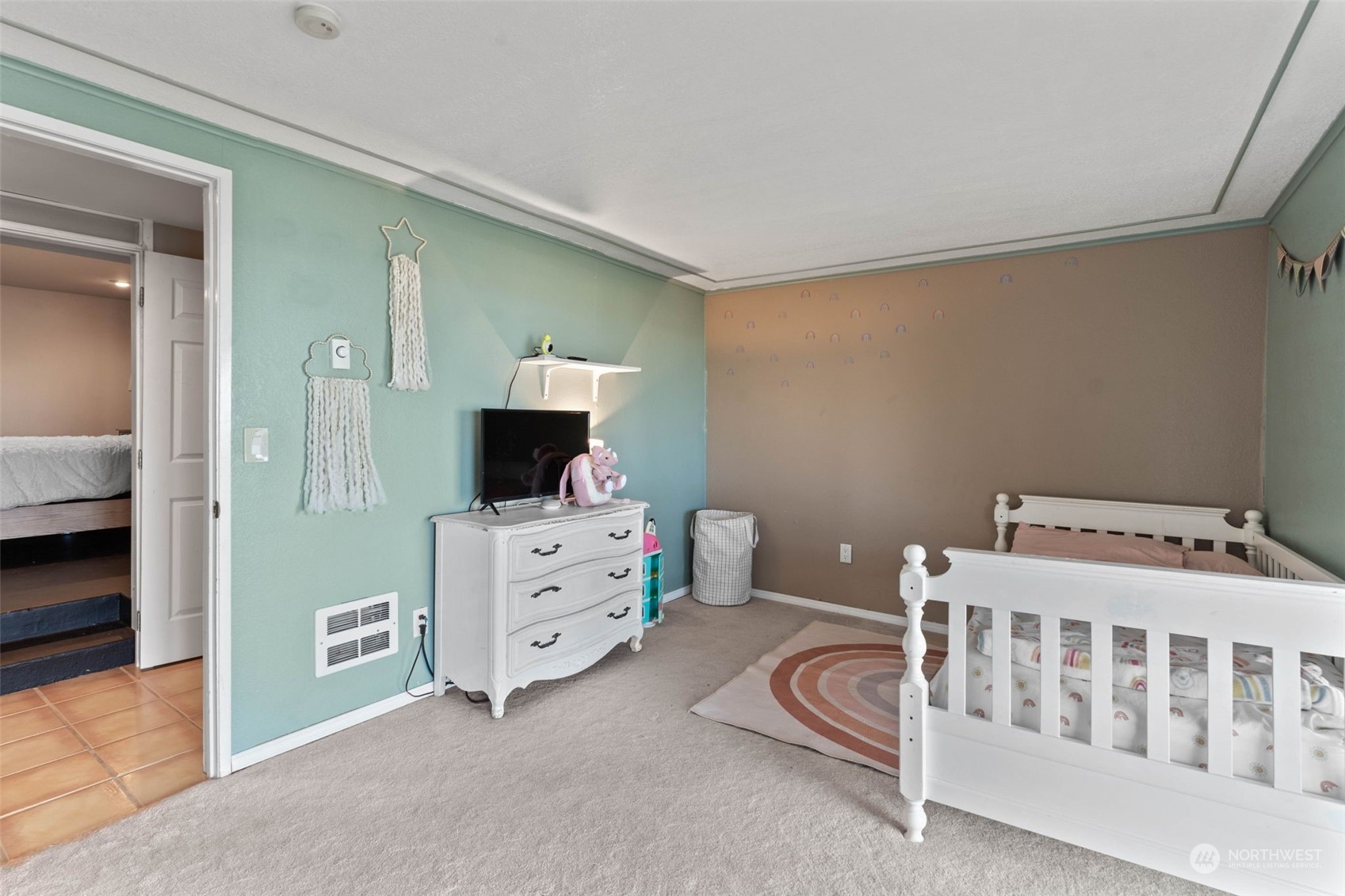 4209 South Eastern Road Spokane, WA 99223 - Photo 32 of 40 a bedroom with furniture and a wooden floor