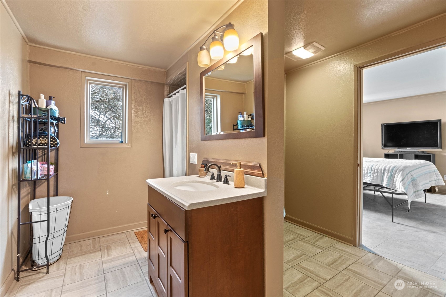 4209 South Eastern Road Spokane, WA 99223 - Photo 34 of 40 a bathroom with a sink a chair and a mirror