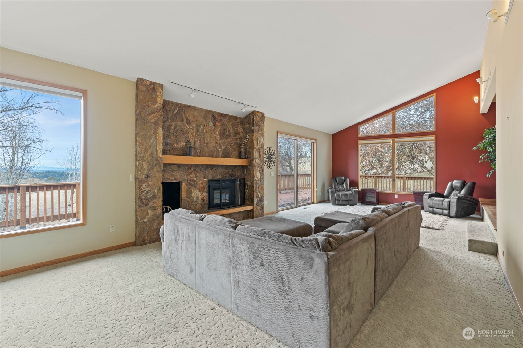 4209 South Eastern Road Spokane, WA 99223 - Photo 5 of 40 a living room with furniture and a fireplace
