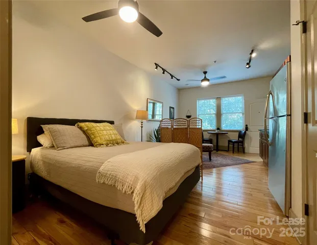 a bedroom with bed and window