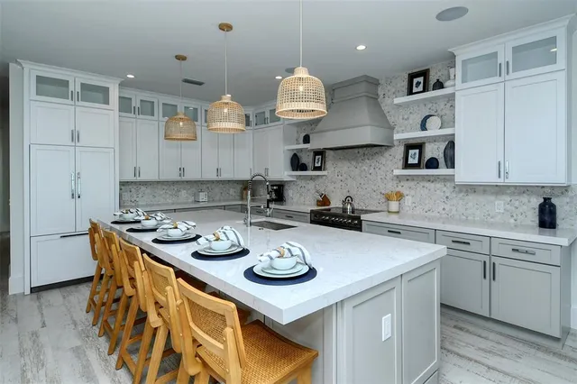 a bathroom with a sink a shower and a mirror