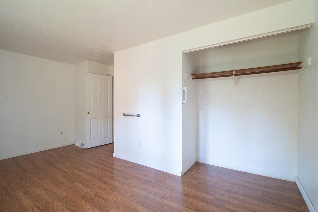 521 Lincoln Rd Extension Hyannis, MA 02601 - Photo 8 of 17 a view of an empty room with wooden floor and a window