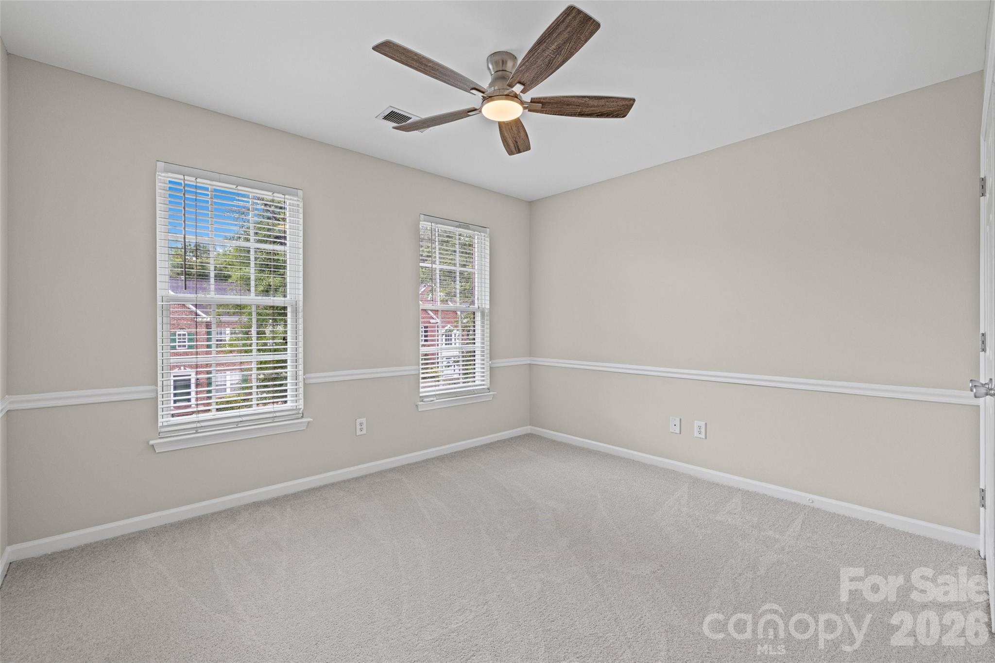 620 East Cheval Drive Fort Mill, SC 29708 - Photo 30 of 48 a view of a livingroom with a ceiling fan and window