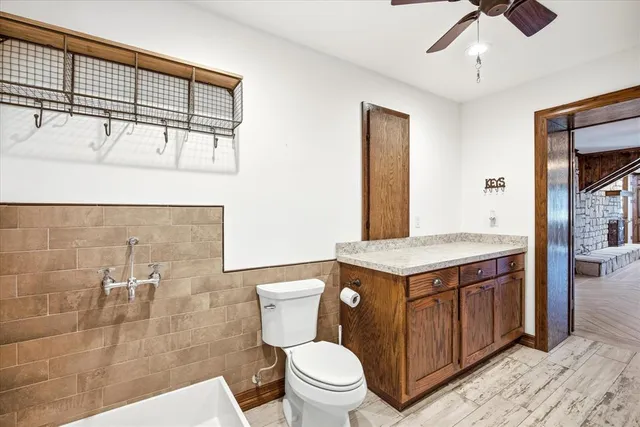 a view of a room with a ceiling fan