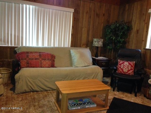 1602 Stein Road Yakima, WA 98908 - Photo 15 of 19 a living room with furniture and a fireplace