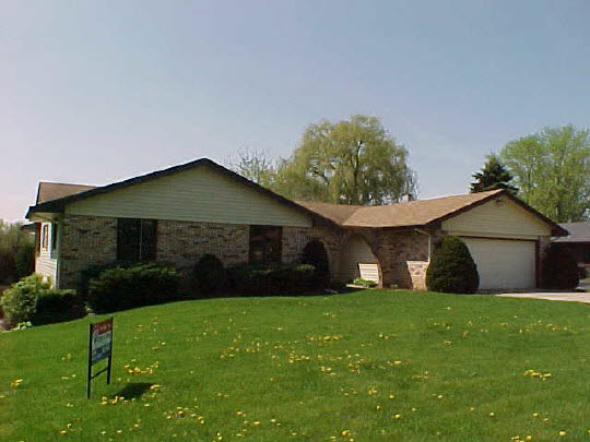 4613 Sunderman Road Rockford, IL 61114 - Photo 1 of 6 a view of a house with a yard