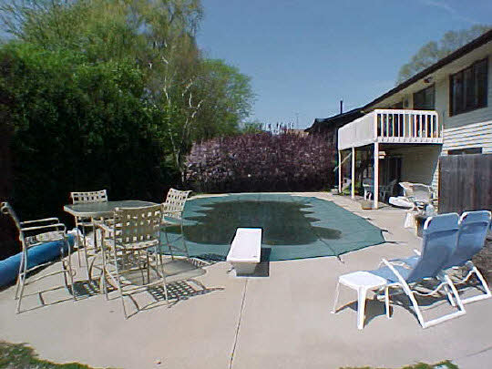 4613 Sunderman Road Rockford, IL 61114 - Photo 4 of 6 a view of a patio with table and chairs and potted plants