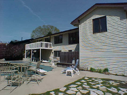 4613 Sunderman Road Rockford, IL 61114 - Photo 5 of 6 a front view of a house with yard and seating space