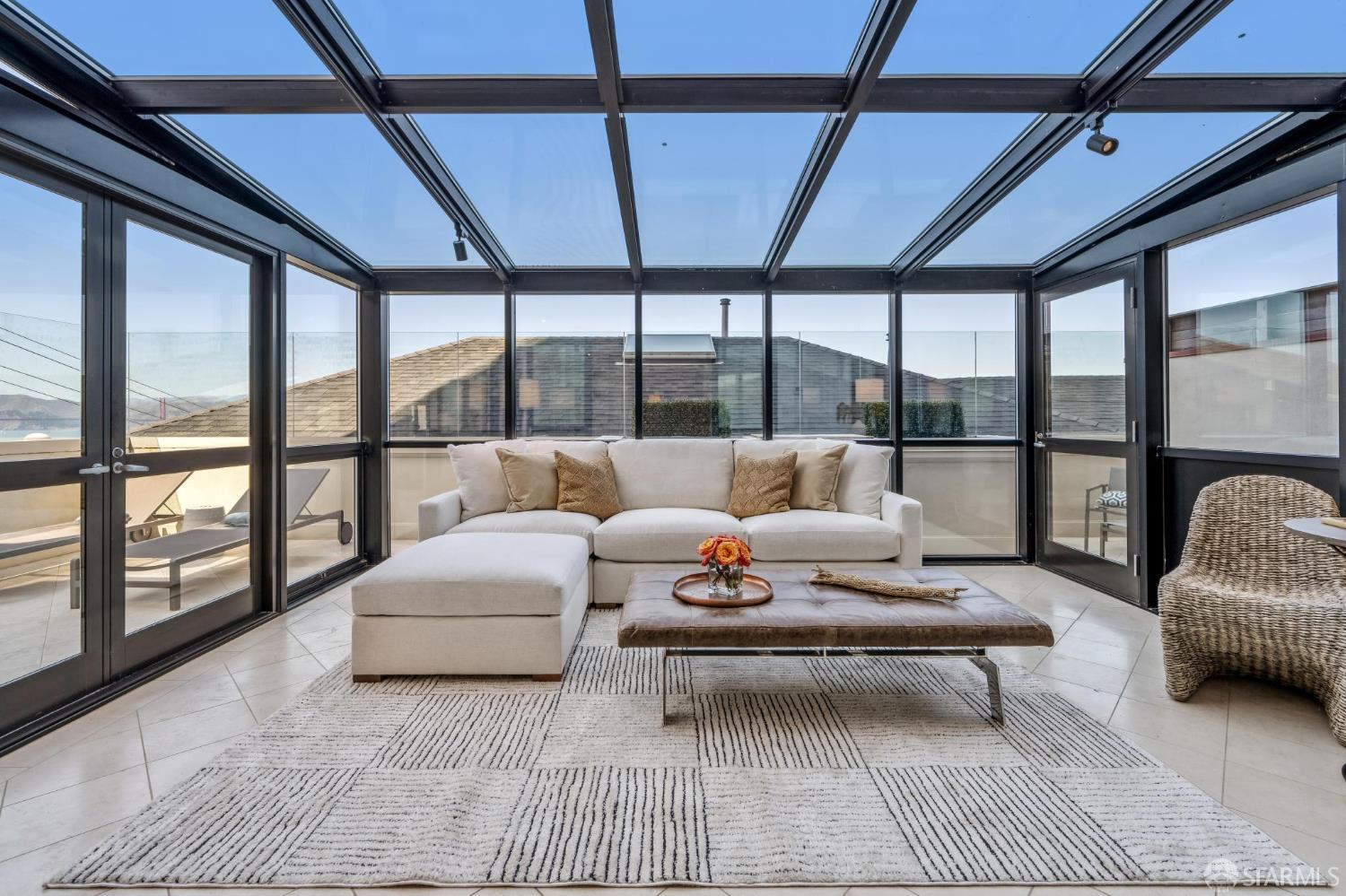 2190 Broadway, Unit 1W San Francisco, CA 94115 - Photo 13 of 66 a living room with furniture and a large window