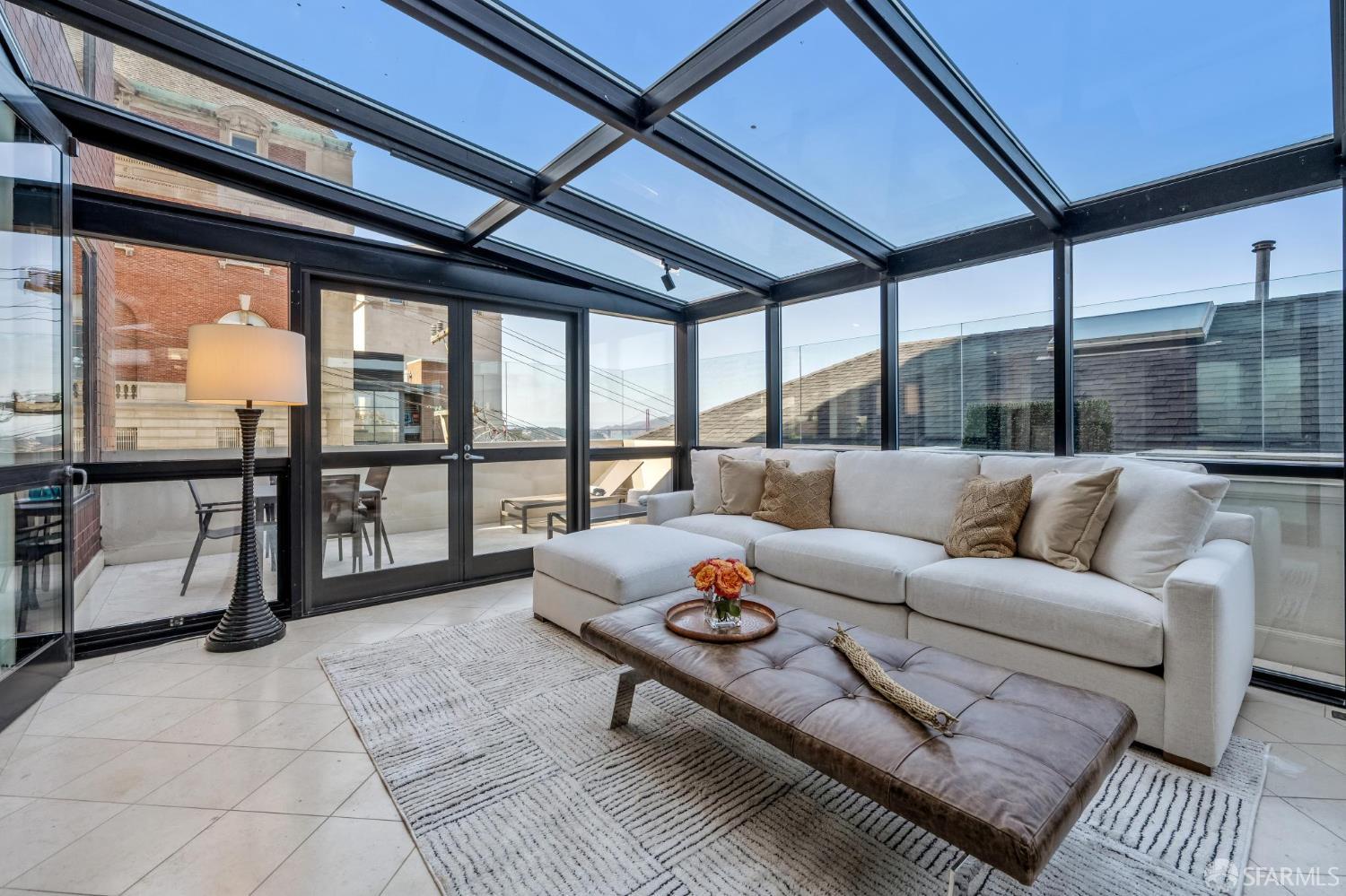 2190 Broadway, Unit 1W San Francisco, CA 94115 - Photo 14 of 66 a living room with furniture and a floor to ceiling window